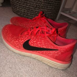 Orange Nike workout shoes